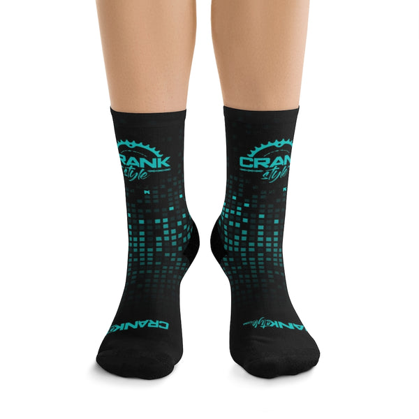 Crank Style's Unisex Teal & Black Matrix Checker 3/4 MTB Socks These socks are made using a proprietary blend of yarns; they are a 200 needle knit crew with half terry cushioned buttons for extra support and comfort. They are truly one size fits most and are available for up to size 12 males (U.S.). They have an unprecedented amount of stretch with durable quality. Great for adding additional style to your daily grind or shredding on the trails. We highly recommend cranking in style with these babies. 