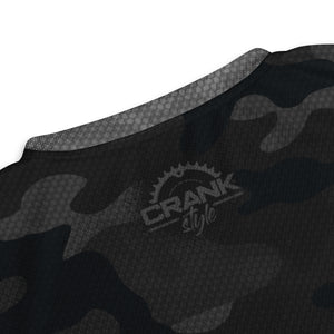 Crank Style's MTN Eagle Black & Grey Camo UPF50+ Unisex Mountain Bike V-Neck Jersey  This unisex Mountain Bike V-Neck Jersey is crafted from 100% recycled polyester for a breathable, moisture-wicking fit. Its double-layered v-neck collar elevates the design for a refined aesthetic.