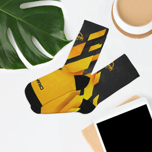 Introducing Crank Style's Unisex MTB socks in Yellow & Grey Abstract Camo design. These soft, breathable, and stylish socks feature a proprietary blend of yarns and 200-needle knit construction. With cushioned bottoms for extra support, they offer a comfortable fit for sizes up to US size 12. These moisture-wicking socks are made with premium fabric composition and are perfect for fashionable mountain biking. Complete your look with matching jerseys. Shop now for trendy and functional MTB socks.