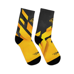 Introducing Crank Style's Unisex MTB socks in Yellow & Grey Abstract Camo design. These soft, breathable, and stylish socks feature a proprietary blend of yarns and 200-needle knit construction. With cushioned bottoms for extra support, they offer a comfortable fit for sizes up to US size 12. These moisture-wicking socks are made with premium fabric composition and are perfect for fashionable mountain biking. Complete your look with matching jerseys. Shop now for trendy and functional MTB socks.