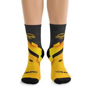 Introducing Crank Style's Unisex MTB socks in Yellow & Grey Abstract Camo design. These soft, breathable, and stylish socks feature a proprietary blend of yarns and 200-needle knit construction. With cushioned bottoms for extra support, they offer a comfortable fit for sizes up to US size 12. These moisture-wicking socks are made with premium fabric composition and are perfect for fashionable mountain biking. Complete your look with matching jerseys. Shop now for trendy and functional MTB socks.